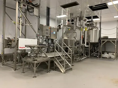 Dry ingredient makedown skid system Dry ingredient makedown skid system
